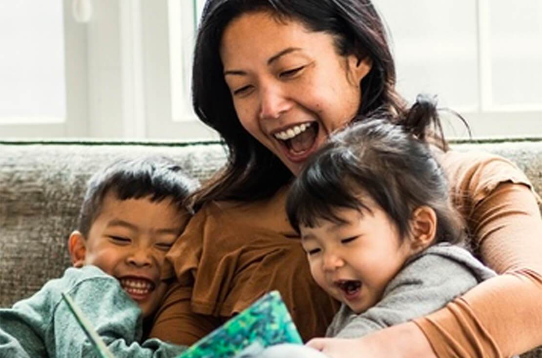 Mother reading with children