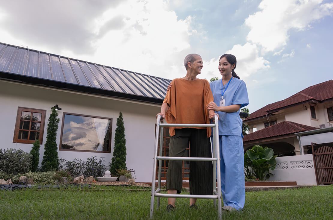 Nurse or caregiver and elderly woman support, healthcare service and health portrait at home. Medical physiotherapy, doctor helping and elderly patient with disability in home.